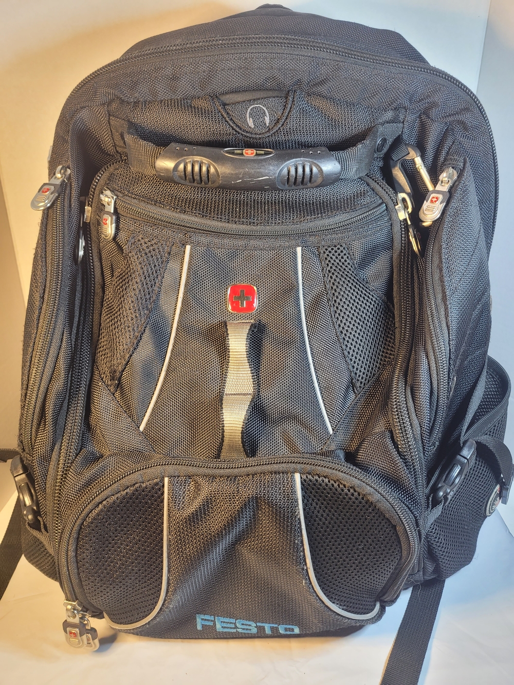 SwissGear Black Backpack with Red Logo and Light Blue Accent